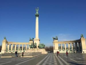 a large white building with a monument in the middle at Trendy & Cozy Apartment at Heroes' Square in Budapest