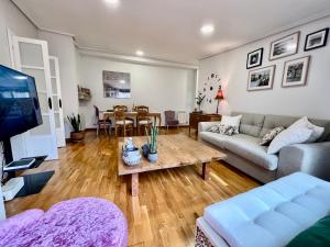 a living room with a couch and a table at VilaVigo in Vigo