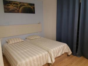 Postel nebo postele na pokoji v ubytování LPA PEREIRA Hotel restaurante