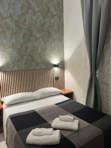A bed or beds in a room at Les Artes