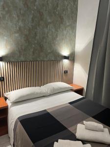 A bed or beds in a room at Les Artes