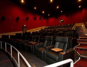 an auditorium with desks and chairs in a theatre at Grand 3br loft in Atlantic Station in Atlanta