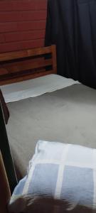 a close up of a bed in a room at Pousada Legal in Chapecó