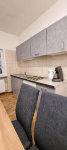 A kitchen or kitchenette at Waterfalls Apartment 2