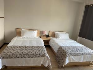 A bed or beds in a room at Kirin Guesthouse and Restaurant