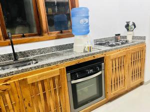 Eldhús eða eldhúskrókur á Casa com quintal
