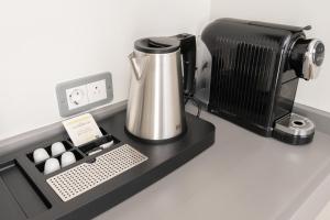 a counter with a coffee maker and a coffeemaker at The Roost on Rock Road in Barry