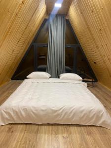 a large bed in a room in a attic at Green Villa Resort Small Gray in Dilijan