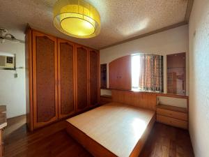 Postel nebo postele na pokoji v ubytování Love Feng Jia Apartment Hotel