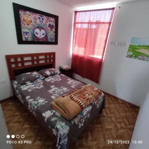 a bedroom with a bed and a window at Departamento-Natural M4 in Chiclayo