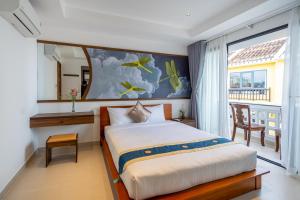 Postel nebo postele na pokoji v ubytování The Present River Villa Hoi An + 37 fotografií
