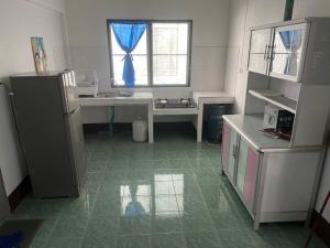 a kitchen with a sink and a window at Kata Vl2_Superior in Ban Karon