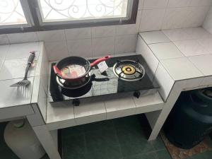 an overhead view of a stove top in a kitchen at Kata Vl2_Superior in Ban Karon