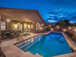 a house with a swimming pool at night at Private house in N Scottsdale in Cave Creek