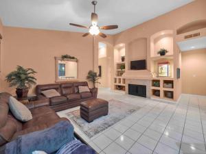 a large living room with couches and a fireplace at Private house in N Scottsdale in Cave Creek