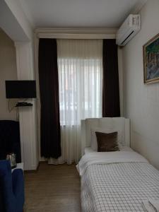 Postel nebo postele na pokoji v ubytování Hotel Zaira