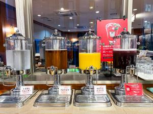 three different types of drinks in containers on a counter at Hotel Abest Naha Kokusai Street in Naha