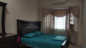 Postel nebo postele na pokoji v ubytování Zulkifli Homestay Tambun,Ulu kinta,Tg Rambutan