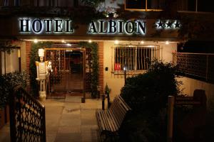 a hotel entrance with a sign that reads hotel infusion at Hôtel Albion in Ajaccio