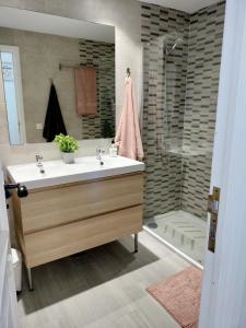 a bathroom with a sink and a shower at Relax And Sunset in Paraiso Adeje in Adeje