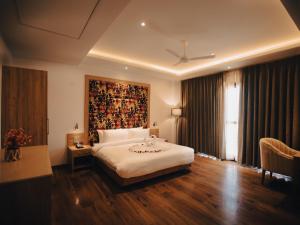 Llit o llits en una habitació de Clarks Inn Express, Dehradun