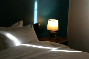 Postel nebo postele na pokoji v ubytování Hôtel Albion