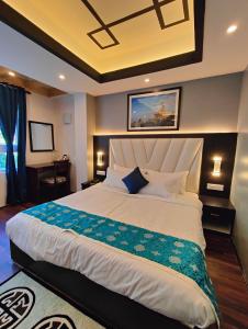 a bedroom with a large bed in a room at Soke Boutique Homestay in Gangtok