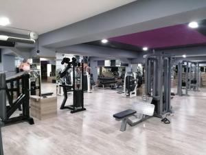 a gym with several treadmills and machines in a room at HOTEL IMPERIAL STRUGA in Struga