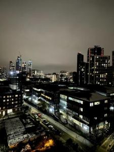 a view of a city at night with at Self-catering fully equipped apartment in Vauxhall in London