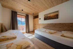 Posteľ alebo postele v izbe v ubytovaní Agriturismo Lüch de Vanc