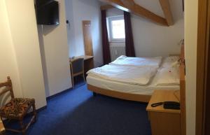 Postel nebo postele na pokoji v ubytování Hotel El Geiger