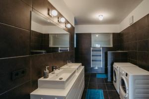 Koupelna v ubytování Mareli Neusiedler Stadthaus + 26 fotografií