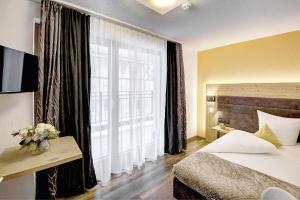 Voodi või voodid majutusasutuse Hotel Ferienglück toas