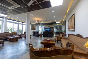 a large living room with couches and a couch at InnBox Farmstay - Rajpura Punjab in Banūr