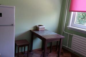 a small table in a room with a window at Apartments near the center and airport in Tallinn