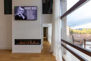 a hallway with a fireplace in a house at The Rock in Sinaia