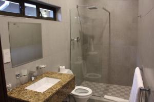 a bathroom with a shower and a sink and a toilet at A pristine BB located in the peaceful suburb of Belvedere Harare - 2007 in Harare