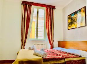 Postel nebo postele na pokoji v ubytování Toffa Place In Rome + 35 fotografií