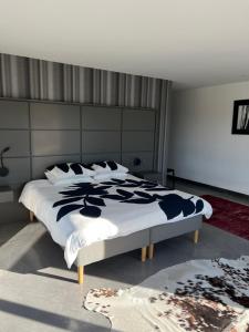 Ένα ή περισσότερα κρεβάτια σε δωμάτιο στο Villa Design