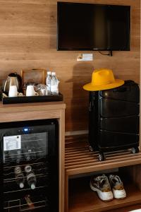 a yellow hat is sitting on top of a microwave at The 5 Stars Sandalwood Lodge in Mount Pleasant - 2020 in Kingsmead
