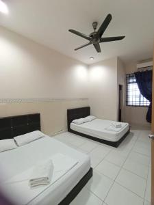 Katil atau katil-katil dalam bilik di Seaview Promenade Homestay Dungun