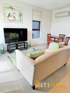 a living room with a couch and a table at Cozy & Comfortable at Campbell - 1 bd 1 bth Apt in Campbell