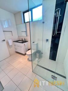 a bathroom with a toilet and a glass shower at Cozy & Comfortable at Campbell - 1 bd 1 bth Apt in Campbell