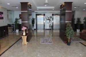 a lobby with plants and elevators in a building at ماجيك سويت المهبولة 5 Magic Suite ALMahboula 5 in Kuwait