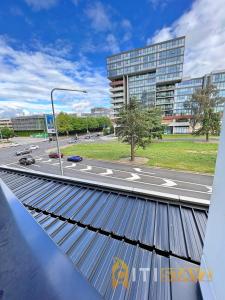 a view from the roof of a building with a street at Beauty in Blue! 1bd 1bth 1crsp Apt - Great Location! in Canberra