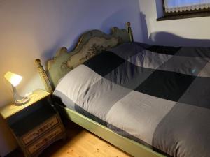 A bed or beds in a room at La casa di nonno carlo