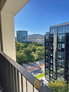 a balcony with a view of a building at Splendid 2bd 1bth 1csp Apt - Superb CBD Location in Canberra