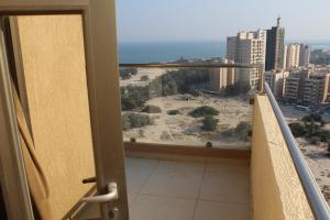 a balcony with a view of a city at ماجيك سويت المهبولة 5 Magic Suite ALMahboula 5 in Kuwait