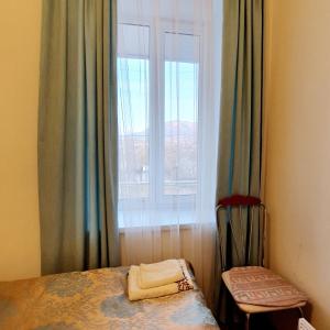 Postel nebo postele na pokoji v ubytování Sunhome Stepanavan Guest House