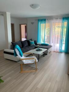 a living room with a couch and a table at Apartman "Anna" in Bribir